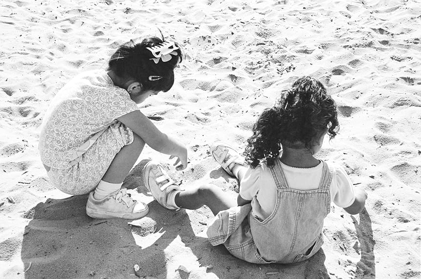 Young children plaing in the sand