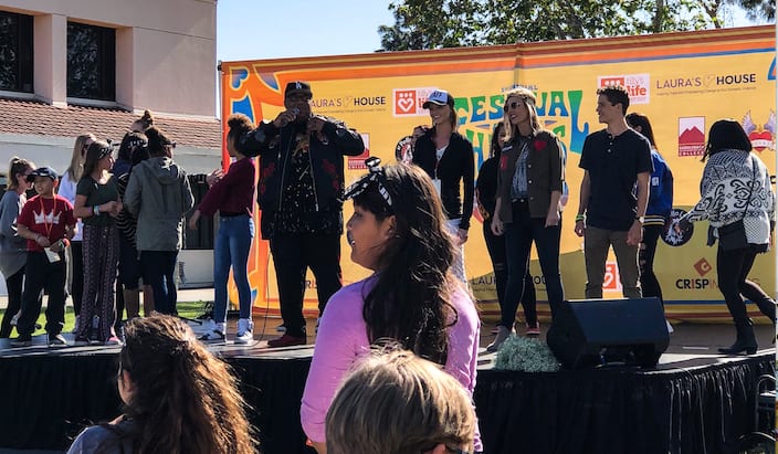 Prior to a performance by Latina hip hop band Bella Dose, their personal announcer got participants to dance on stage and gave away a cash prize